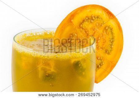Traditional Colombian Beverage Made Of Juice And Pieces Of Lulo (solanum Quitoense) Called Lulada
