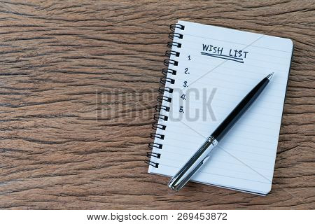 Wish List Concept, Pen On White Paper Note Pad With Handwritten Headline As Wish List And Numbers Li