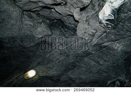 Beautiful Cave. View From Inside Dark Dungeon. Textured Walls Of Cave. Background Image Of Undergrou