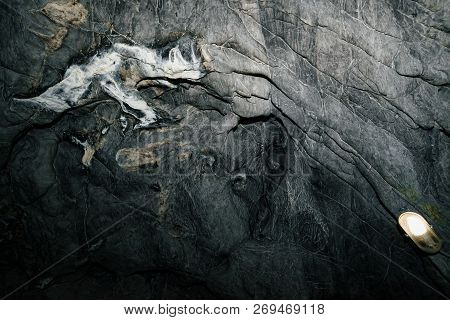Beautiful Cave. View From Inside Dark Dungeon. Textured Walls Of Cave. Background Image Of Undergrou
