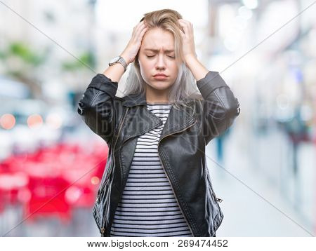 Young blonde woman wearing fashion jacket over isolated background suffering from headache desperate and stressed because pain and migraine. Hands on head.