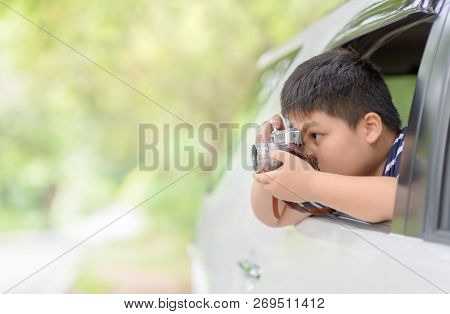 Kid Take Picture With Vintage Camera From Window Car