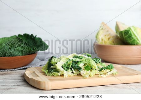 Cutting Board With Chopped Savoy Cabbage On Table