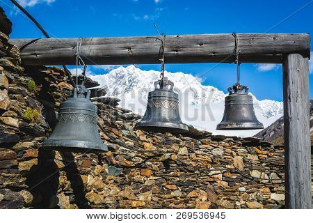 Bells In Lamaria Church In Zhibiani - Ushguli Community Of Villages, Upper Svaneti, Georgia. Snow Co