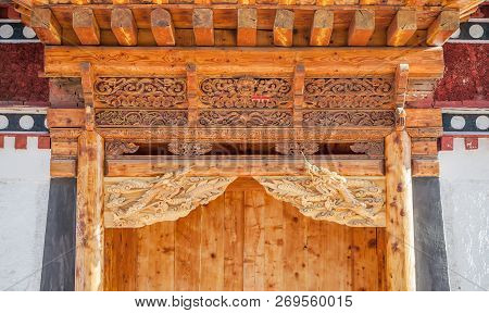 Wood Ornaments Which Decorate Gates Of The Houses In Xiahe Village, Labrang Monastery, Gansu Provinc
