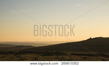 Beautiful Sunset Silhouette Landscape Image Of Foggintor In Dartmoor