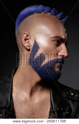 Young Man With Blue Hair And Creative Makeup And Hair.