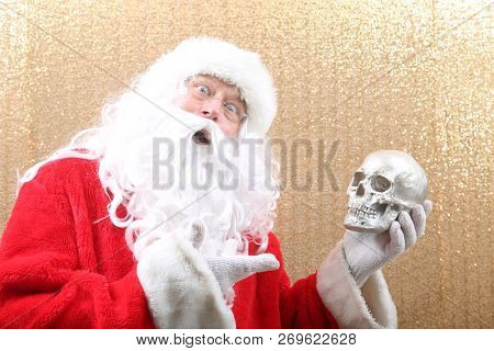 Santa Claus. Santa Preforms Shakespeare's Hamlet.  
Alas, poor Yorick! I knew him, Horatio, a fellow of infinite jest, of most excellent fancy. He hath borne me on his back a thousand times, and now,
