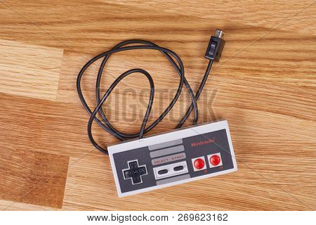BUDAPEST, HUNGARY - DECEMBER 10, 2017: Nintendo NES classic controller hanging from above. One of the most classic gaming consoles