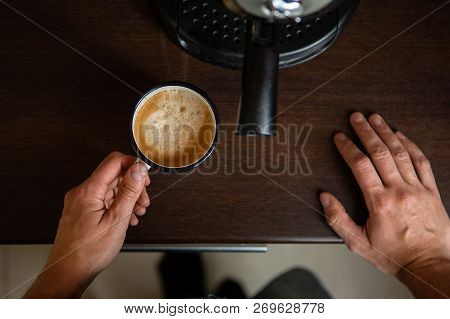 Photo Of Coffee Maker, Hands Of Man Pouring Coffee In Mug At Kitchen