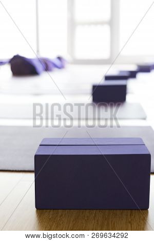 Empty, Bright Yoga Studio With Mats And Foam Blocks. Wooden Floor.