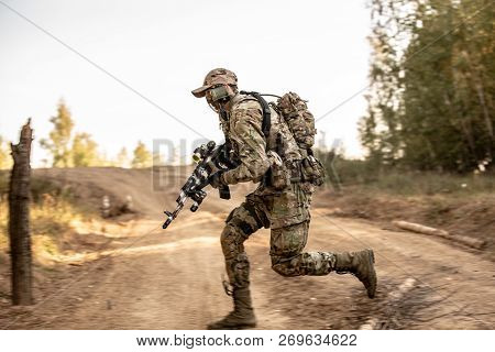 Group Of Soldiers On The Outdoor On Army Exercises. War, Army, Technology And People Concept