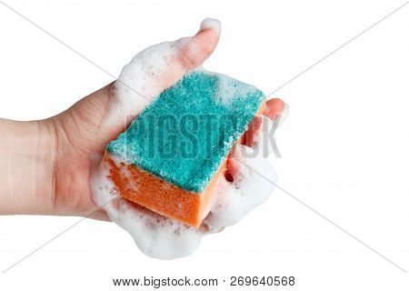 Hand Compresses A Soapy Sponge For Washing Dishes On A White Background