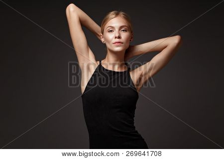Fashion Model With Long Hair, Perfect Skin Is Posing In Studio For Glamour Test Photo Shoot Showing 