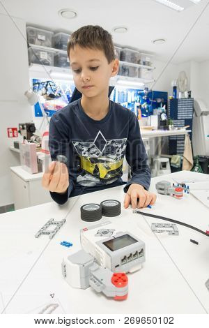Vilnius, Lithuania - November 16, 2018: Kid Making Lego Robot Mindstorms. Robotic, Learning, Technol
