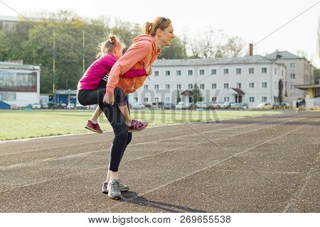 Sports Cheerful Family, Healthy Lifestyle, Spring Portrait Of Mother And Little Daughter Having Fun 