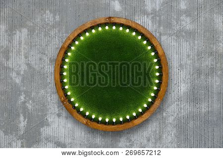 Close Up One Round Shape Wooden Ring Light Frame With Lightbulbs And Backdrop Of Illuminated Vivid G