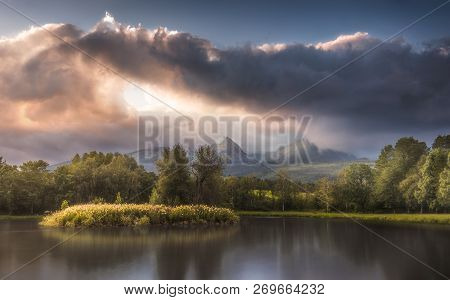 Strba Lake Under The  Peaks Of High Tatras Mountains Lit By Golden Light At Sunset