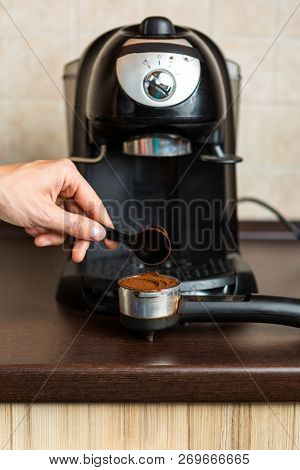 Photo Of Coffee Maker, Human Hand Pouring Coffee Into Mug In Kitchen