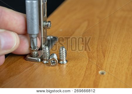 Installation Of Chipboard Furniture In A Carpentry Workshop. Accessories And Tools For Carpenters.