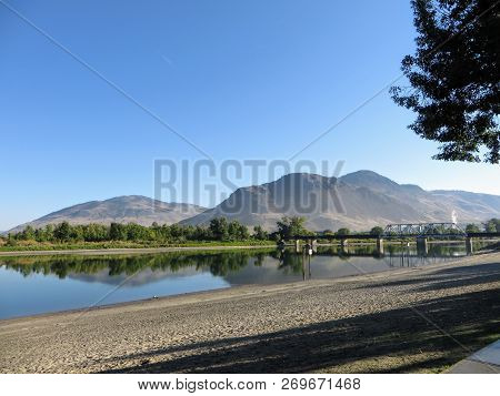 Bridge Cross The North Thompson River, In Kamloops, British Columbia, Canada.  Beautiful Reflection 