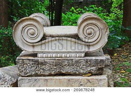 Ruins Of Ionian Style Scrollwork From The Top Of An Ancient Greek Column In The Athens Greece Nation