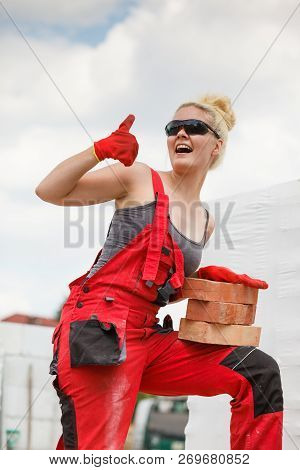 Woman Working With Bricks