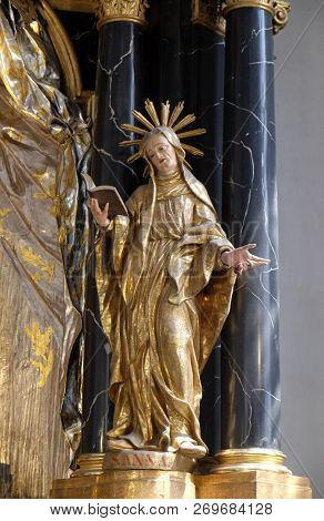 WURZBURG, GERMANY - JULY O4, 2018: Saint Anne statue on the Virgin Mary altar in the Neumunster Collegiate Church in Wurzburg, Germany