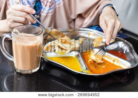 Roti Prata Or Canai Set With Curry, Dhal And Sambal. Favorite Breakfast In Malaysia