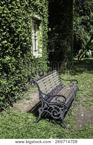 Bench And Ivy House In Local Resort, Stock Photo