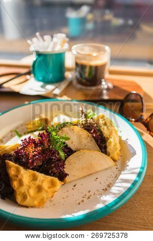 View Of Healthy Salad And A Cup Of Coffee For Breakfast. Salad Of Grilled Halumi Cheese, Pear And Le