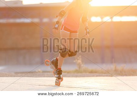 Young Teenage Girl Speed Skating On Rollerdrome