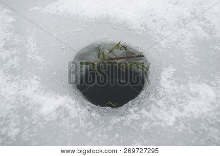 Cut Hole For Ice Fishing With Algae Inside It, Top View