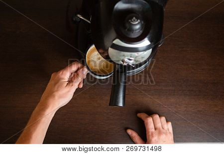 Photo Of Coffee Maker, Hands Of Man Pouring Coffee In Mug At Kitchen