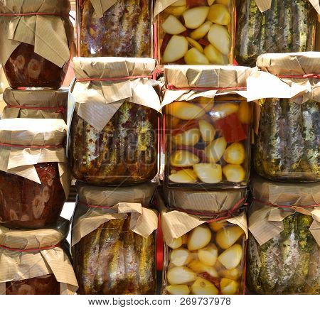 Background Of Many Glass Jars With Typical Italian Food From Calabria Region Garlic Anchovies Very S