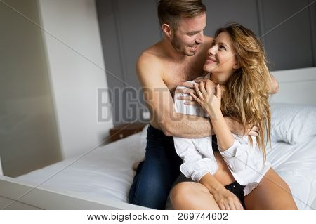 Attractive Sexy Woman With Her Partner In Bedroom