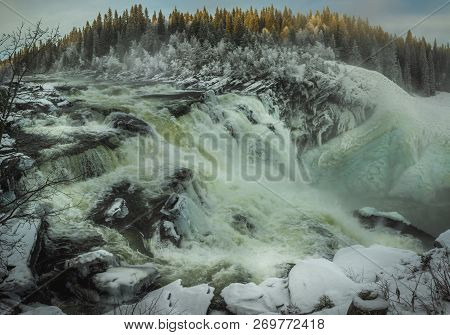 Biggest Frozen Swedish Waterfall Tannforsen In Winter Time