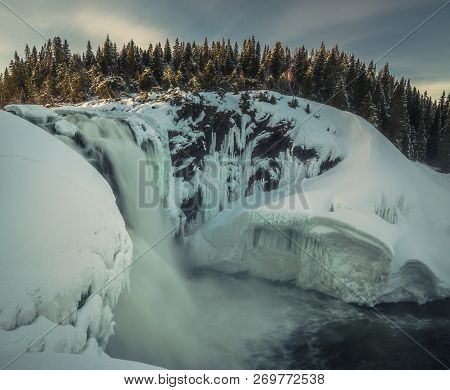 Biggest Frozen Swedish Waterfall Tannforsen In Winter Time