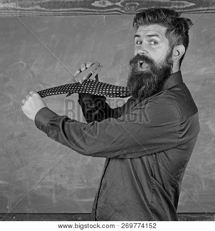 Hipster Teacher Formal Wear Necktie Holds Stapler. School Stationery. Man Scruffy Use Stapler Danger