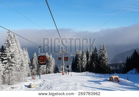 Jasna, Slovakia - January 25, 2017: View Of The Ski Slope, Cableway And Low Clouds In The Jasna Ski 