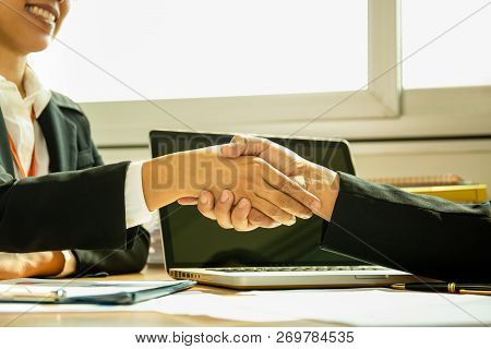 Business Shaking Hands Agreement Successful In Office.