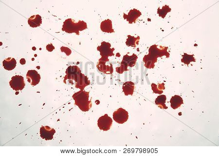 Blood-stained White Surface. Disgusting View To The Blood Drops On Whiteness. Bloody Spits On White.