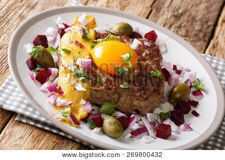 Portion Of Danish Pariserbof Parisian Steak With Vegetables And Mustard Close-up On A Plate. Horizon