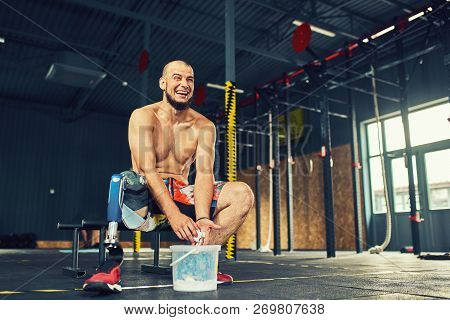 Sportsman With Prosthesis Working Out In Gym