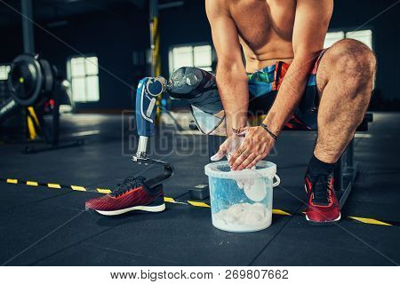 Sportsman With Prosthesis Working Out In Gym