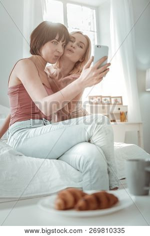 Lovely Female Partners Taking Morning Selfie Together