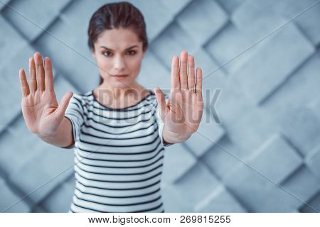 Serious Active Female Stopping Assaults With Her Hands