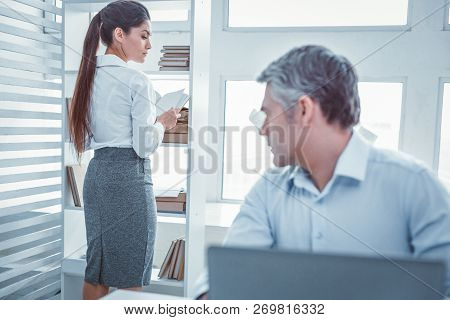 White Collar Office Worker Staring At His Colleague