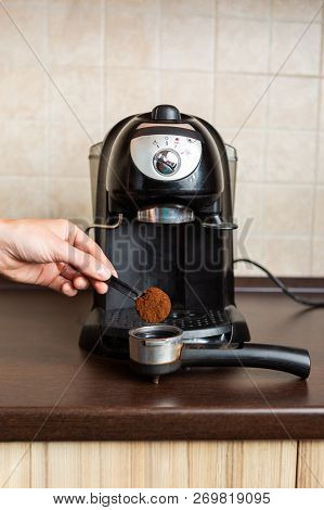 Photo Of Coffee Maker, Human Hand Pouring Coffee Into Mug In Kitchen