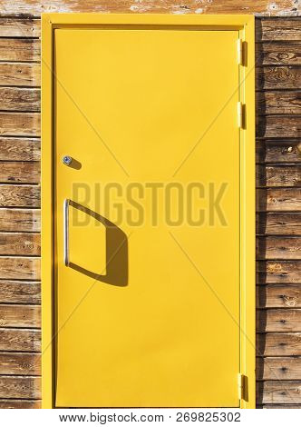 Bright Yellow Front Door With Shadows, Vertical Photo.